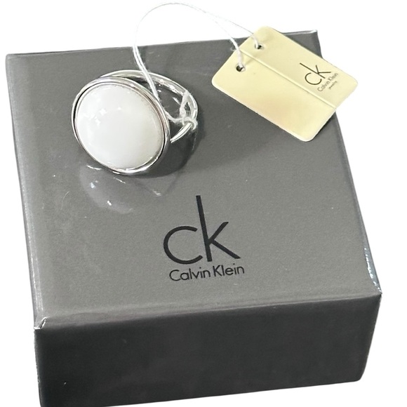 Calvin Klein NWT Loop Two Tone Ring with a Round White Coral Stone Size 9 - Picture 5 of 8